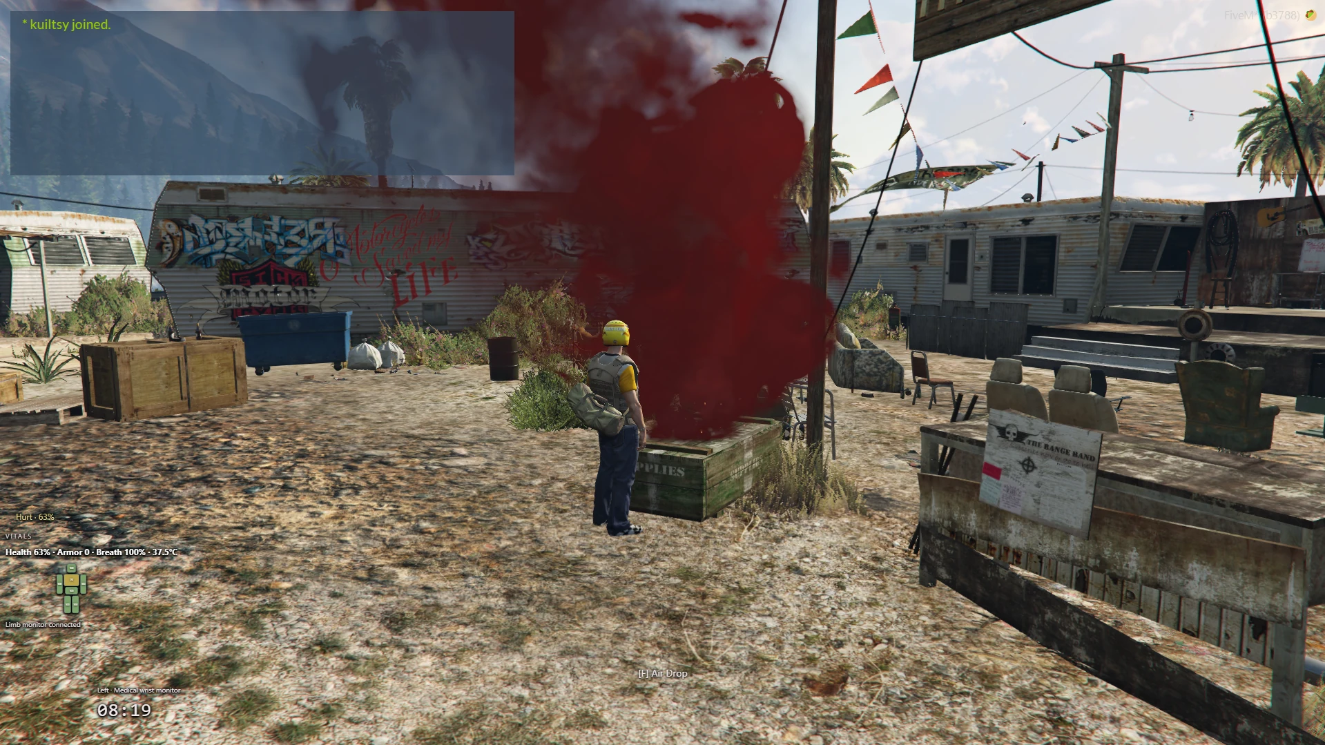 KuiLTsiA survivor beside a supply drop